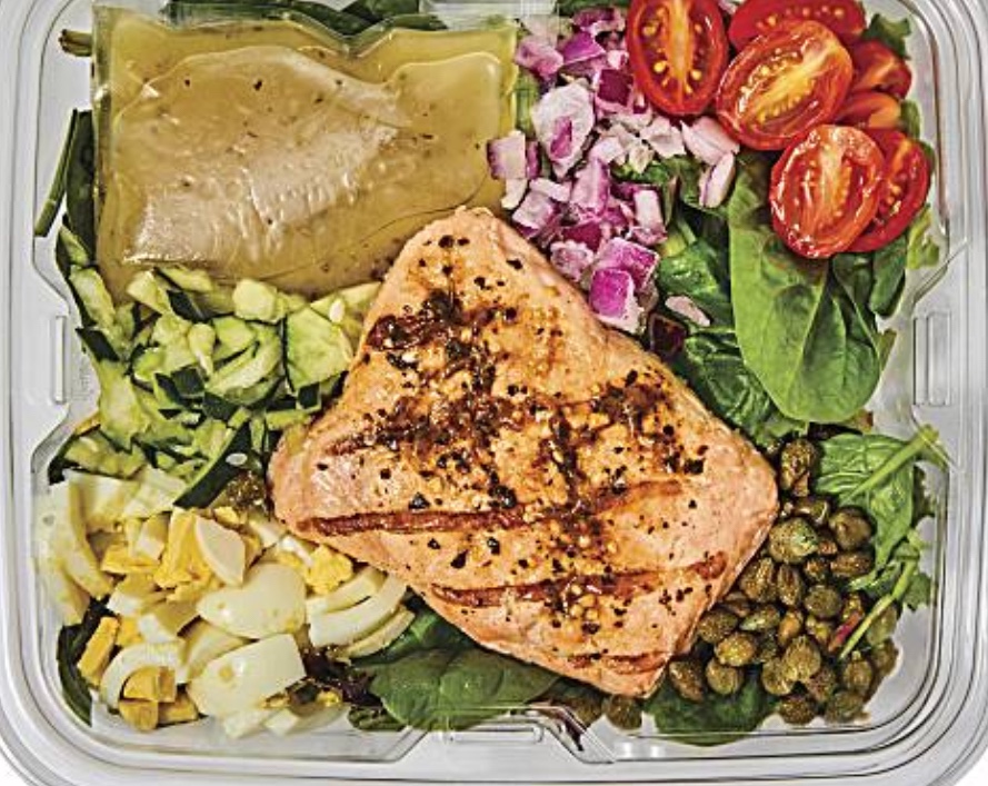 Publix Grocery Store Ready Made Deli Salad includes spring mix greens, wild caught salmon, capers, hard boiled egg, cucumber, tomatoes, and dressing.